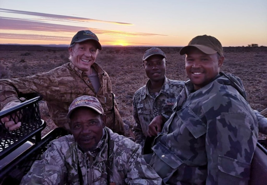 Men from the Black Dagger Military Hunt Club on free vacations in Africa