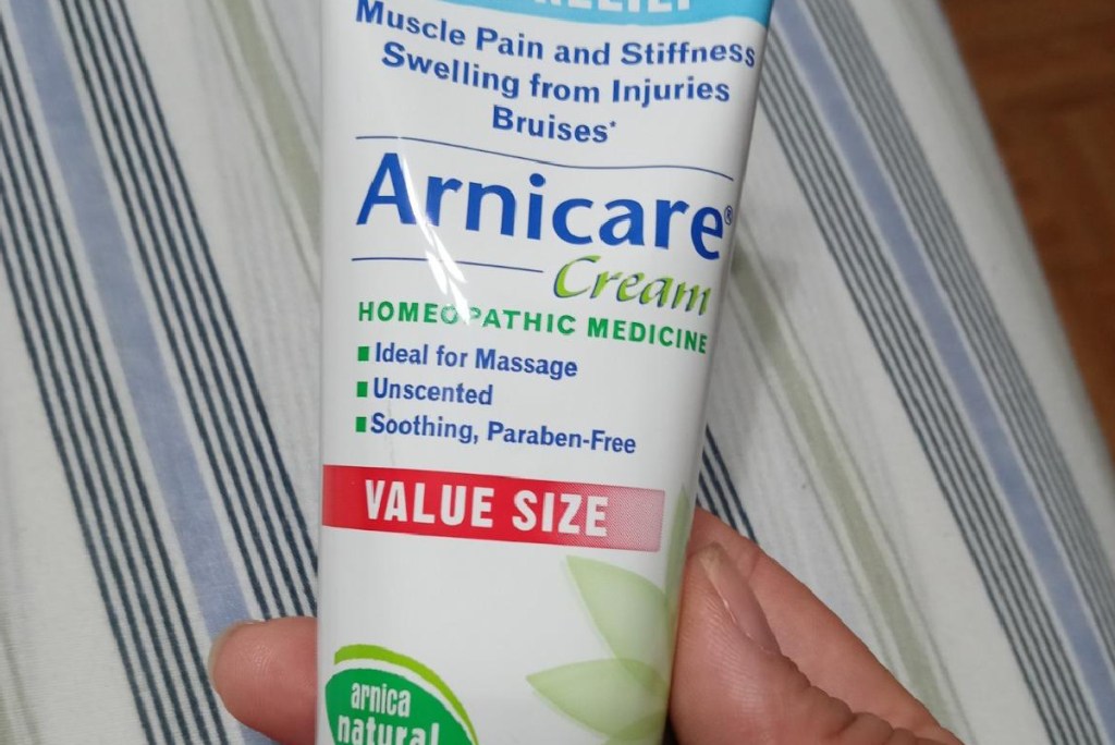 Boiron Arnicare Soothing Relief 4.2oz  Cream in persons hands