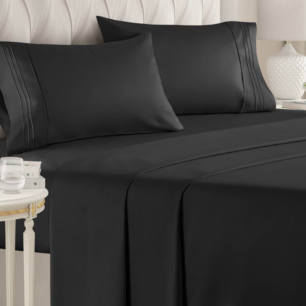 CGK full sheet set on a bed in black microfiber