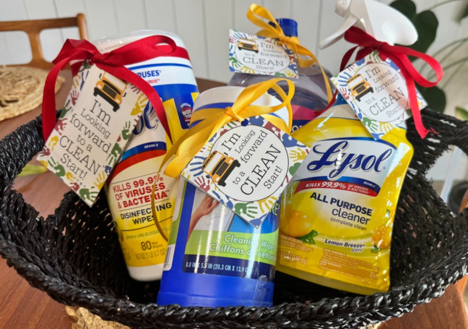 A basket of cleaning supplies as teacher gifts using our free printable