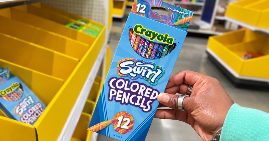 hand holding a box of Crayola Swirl Colored Pencils in store