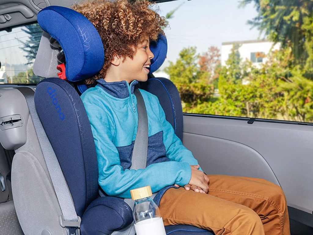 Boy sitting in a booster seat