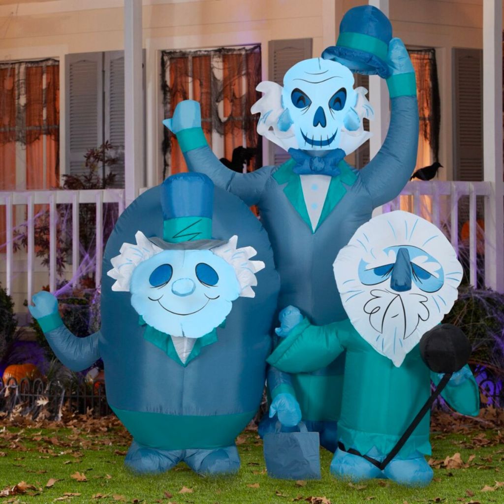 Disney 6-ft Lighted Hitchhiking Ghosts Inflatable in a front yard
