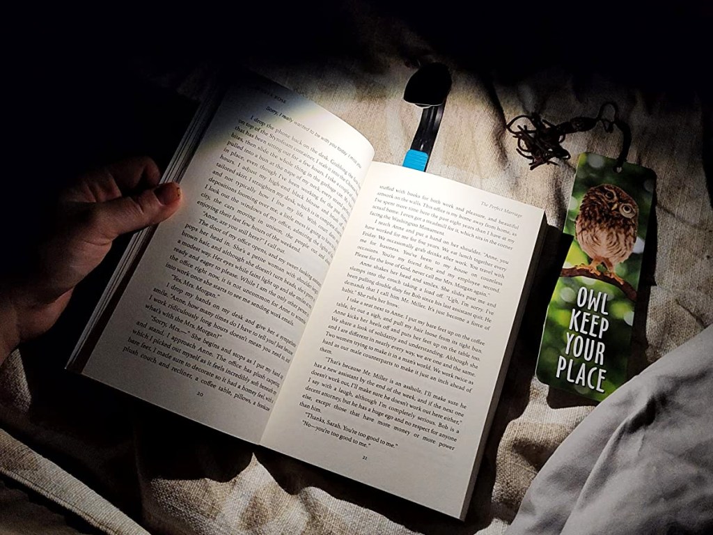 book light shining on an opened book