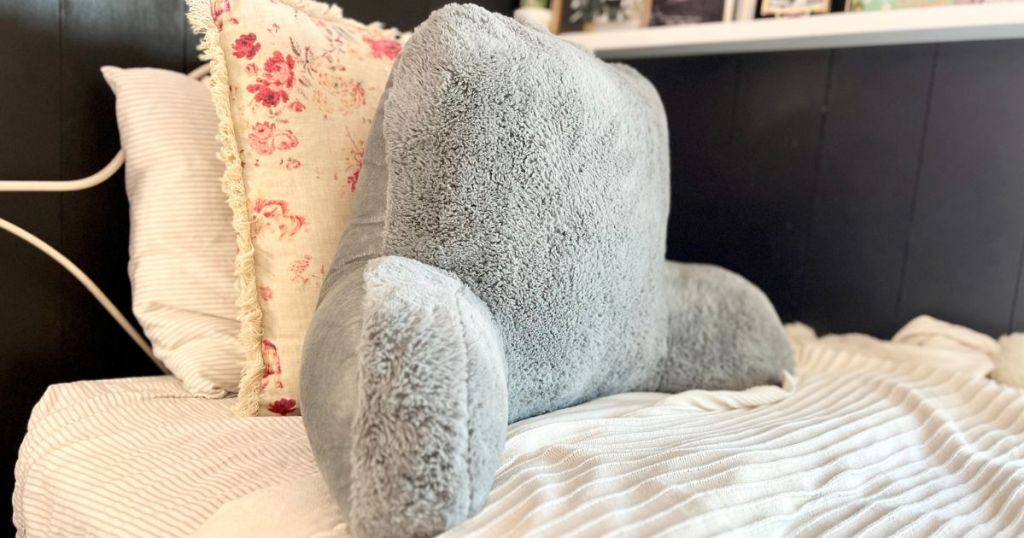 Faux Fur Backrest Pillow on a bed