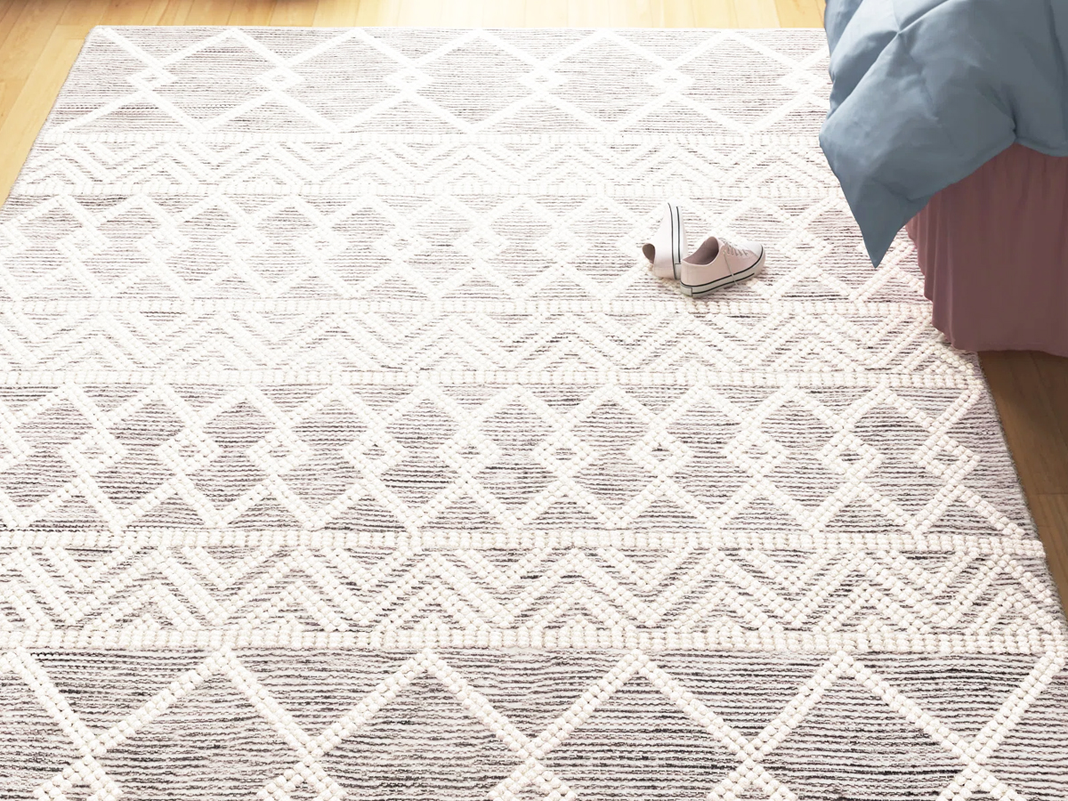 grey and white geometric print area rug