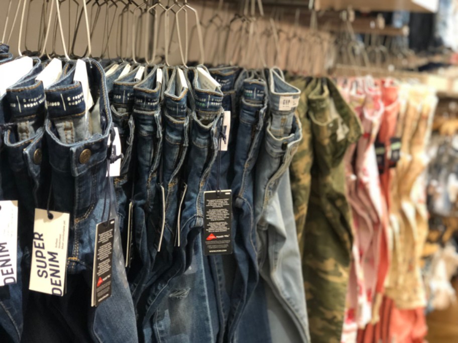 variety of GAP brand jeans on a store rack