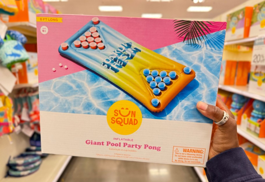 hand holding up a Giant Pool Party Pong Raft for adults