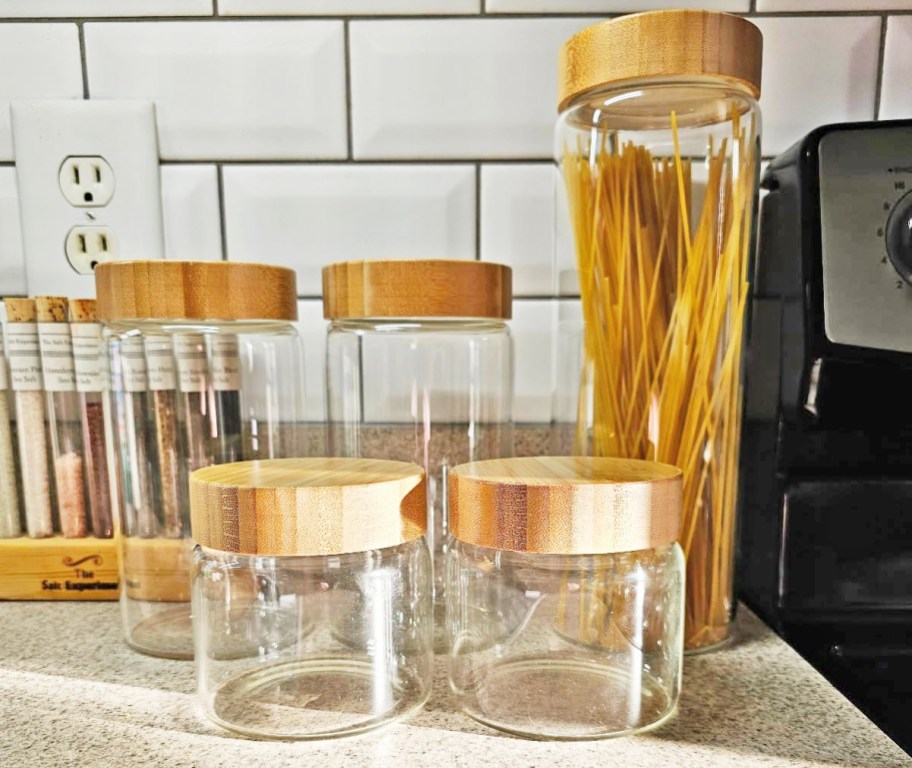 set of glass storage containers on kitchen counter