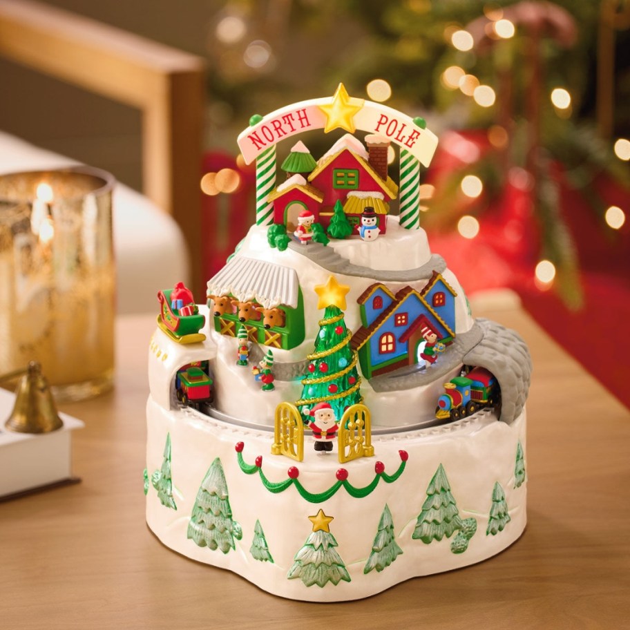 a holiday village piece of the North Pole with Santa, Elves, toys, and more