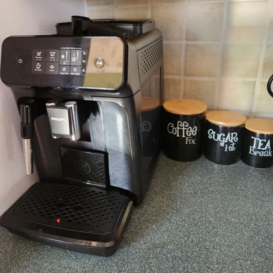 Philips 1200 Series Espresso Maker shown on countertop with canisters