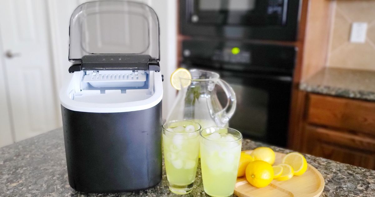 Free Village Countertop Ice Maker on counter with lemonade and glasses beside of it