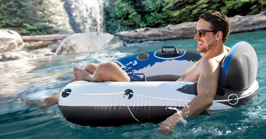 Intex River Run Tube w/ Backrest & Cupholders shown with man floating on the water in it