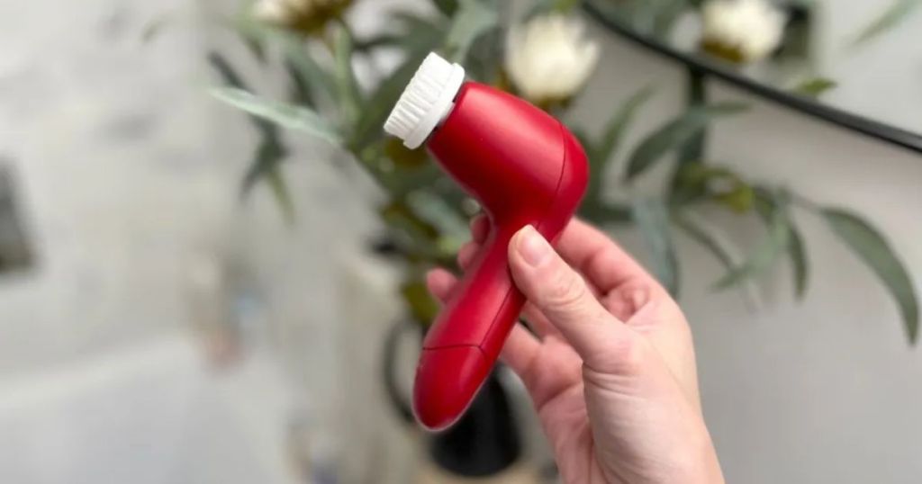 Olay Cleansing Brush in woman's hand