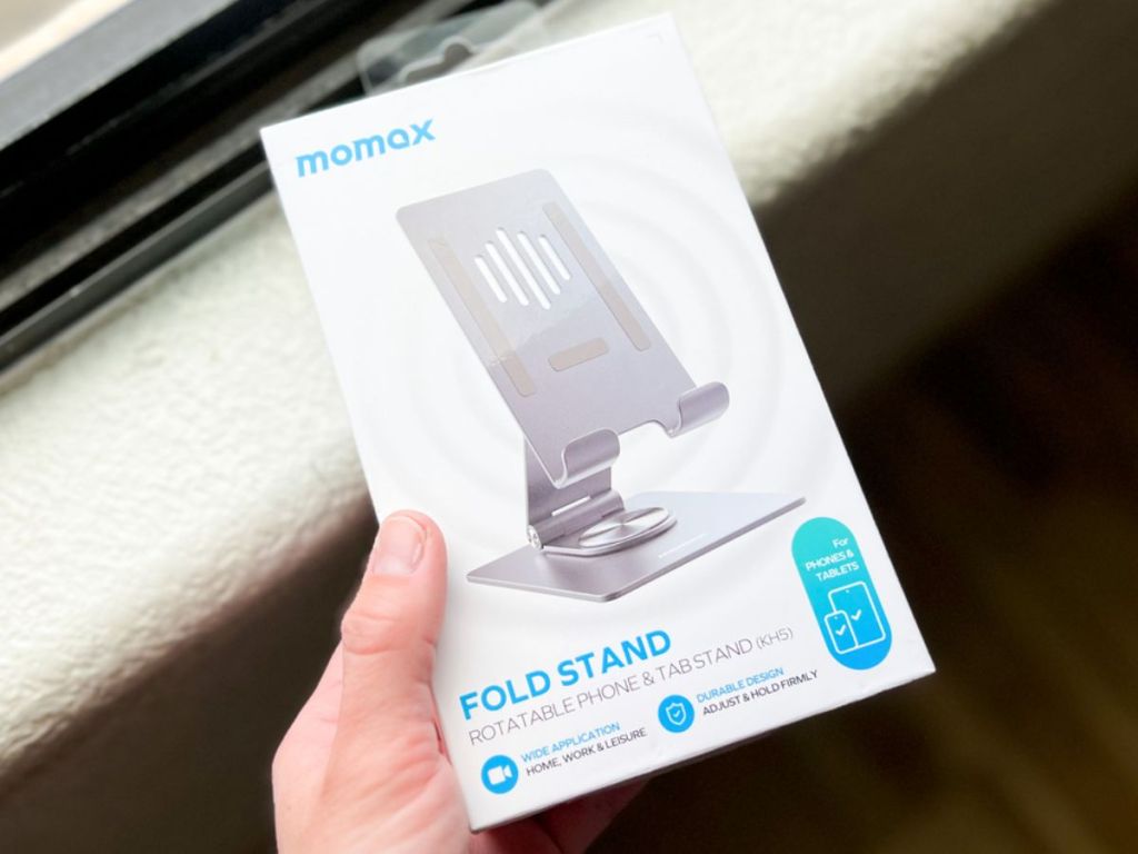 MOMAX Rotating Tablet iPad Stand in box in woman's hand