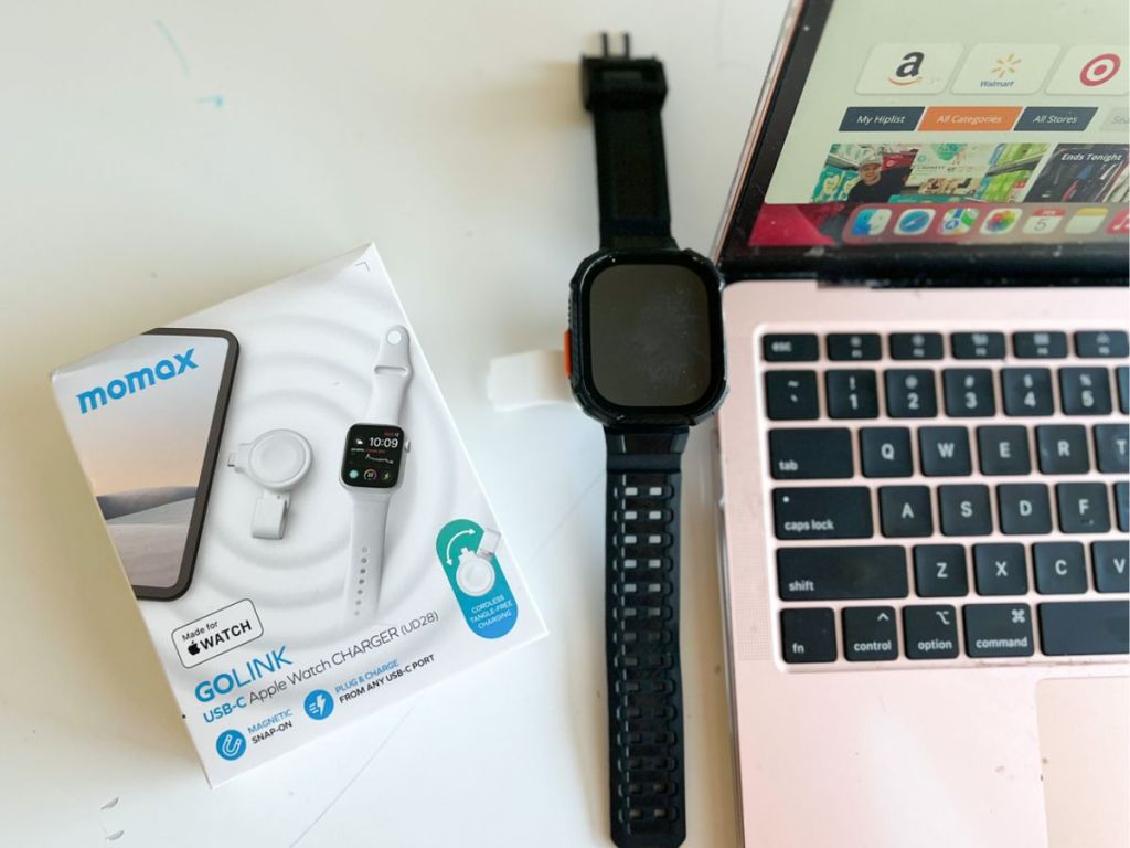 MOMAX Portable Apple Watch Charger shown plugged into a laptop and charging a watch