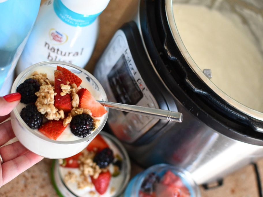 Woman making homemade yogurt inside instant pot