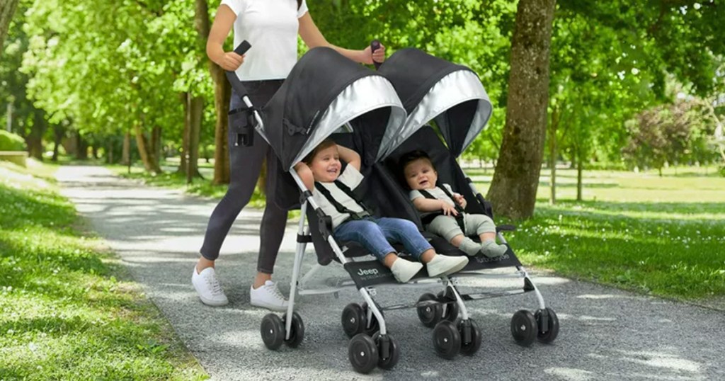 Jeep TurboGlyder Double Stroller being used by two children in a park