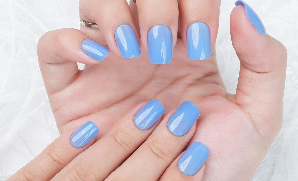 Jofay nails displayed on both hands in skyblue