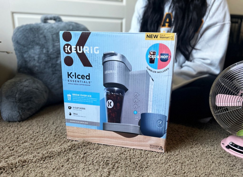 A college student sitting next to her Keurig K Iced Coffee Maker