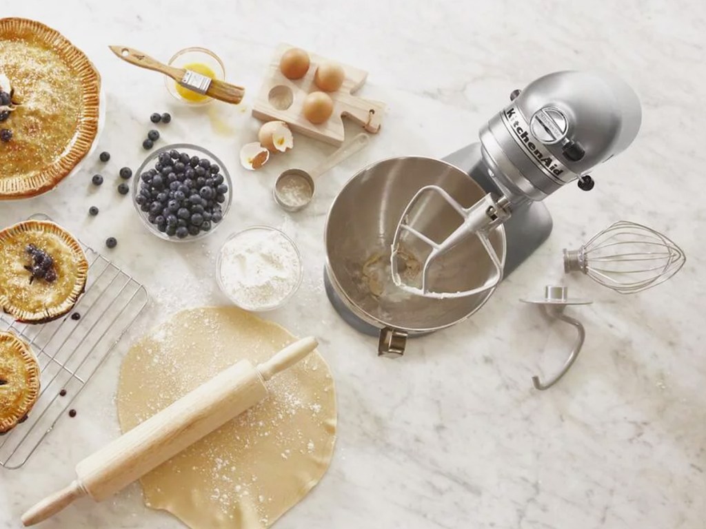 silver kitchenaid mixer on counter near pie baking supplies