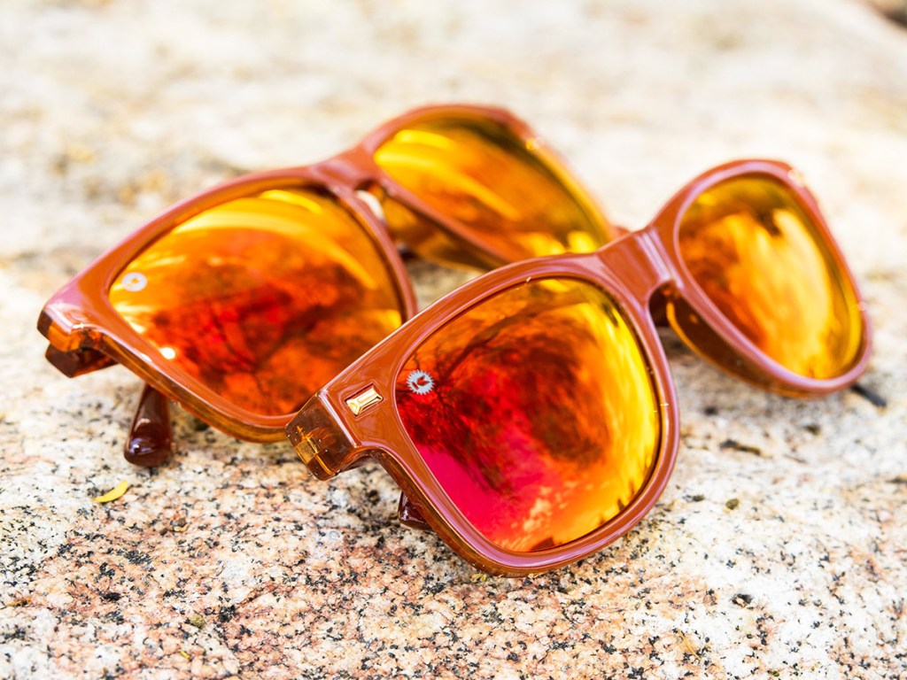 two pairs of orange sunglasses