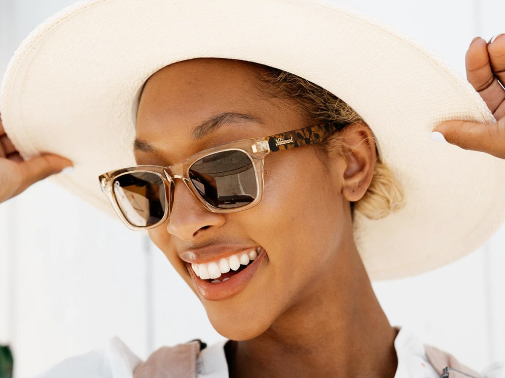 woman wearing sun hat and sunglasses