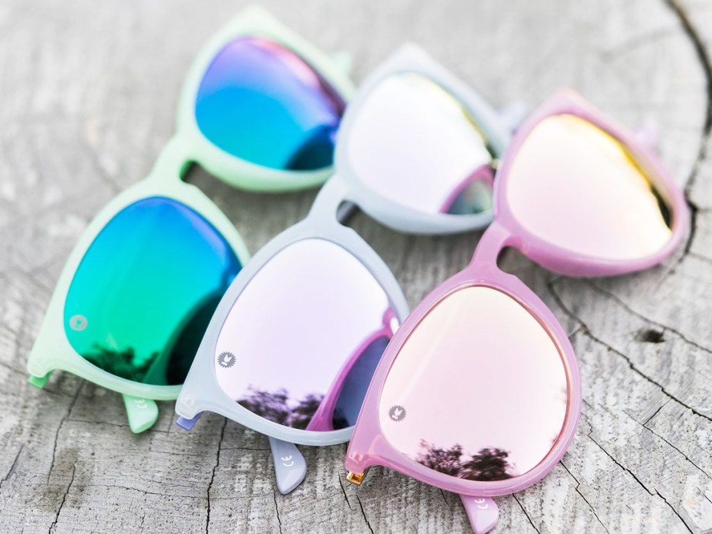 pairs of pastel green, purple, and pink sunglasses