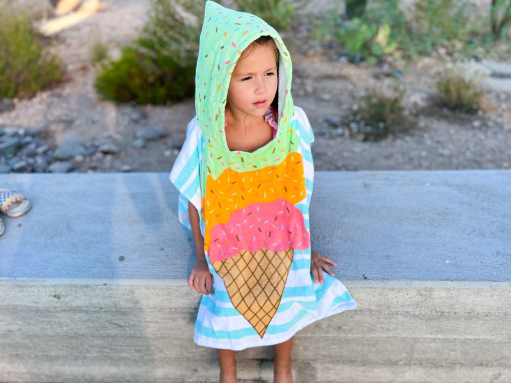little girl wearing Kohls Hooded Beach Towel in ice cream pattern