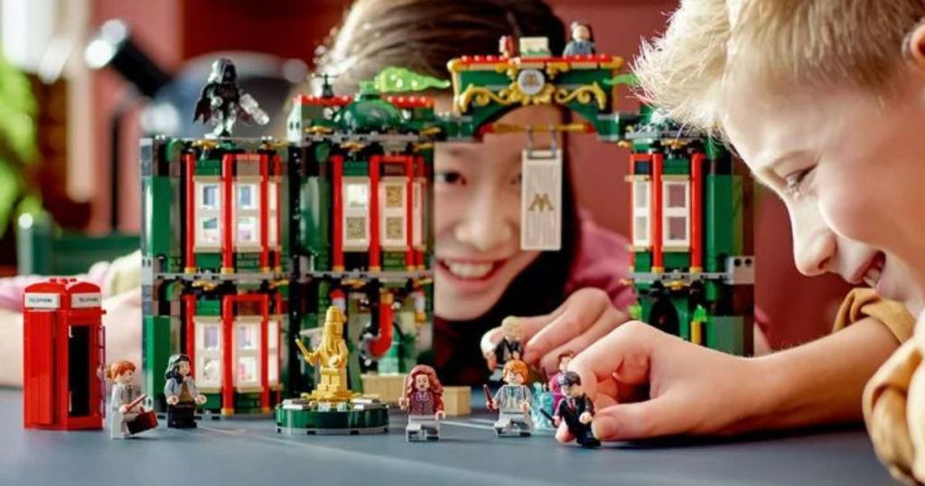 Two kids playing with the Lego Ministry of Magic Set