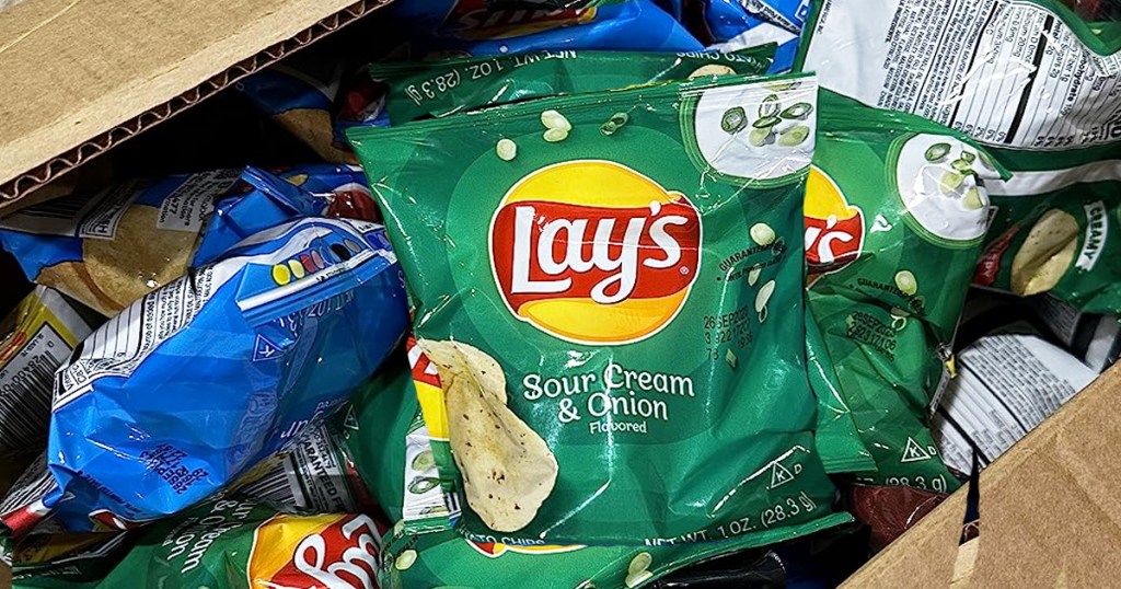 shipping box full of small bags of Lay's potato chips