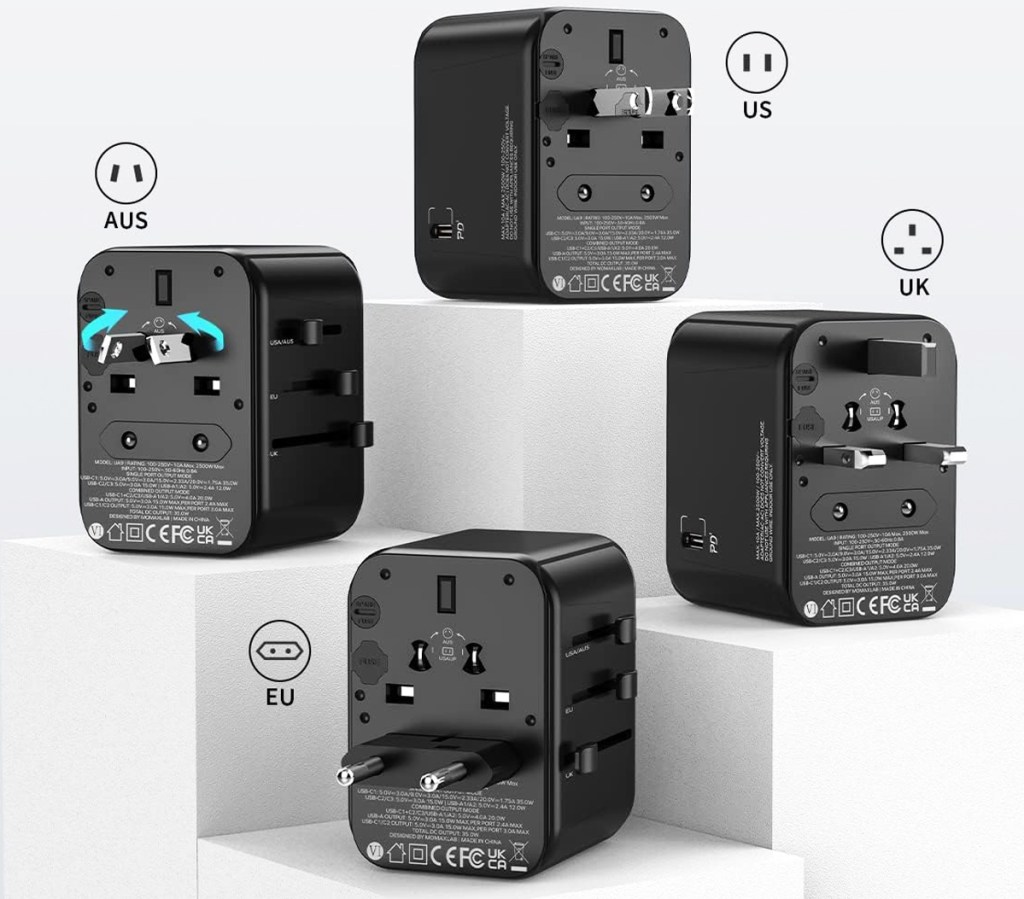four black travel adapter plugs