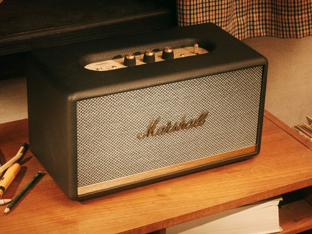 A Marshall wireless speaker on a table