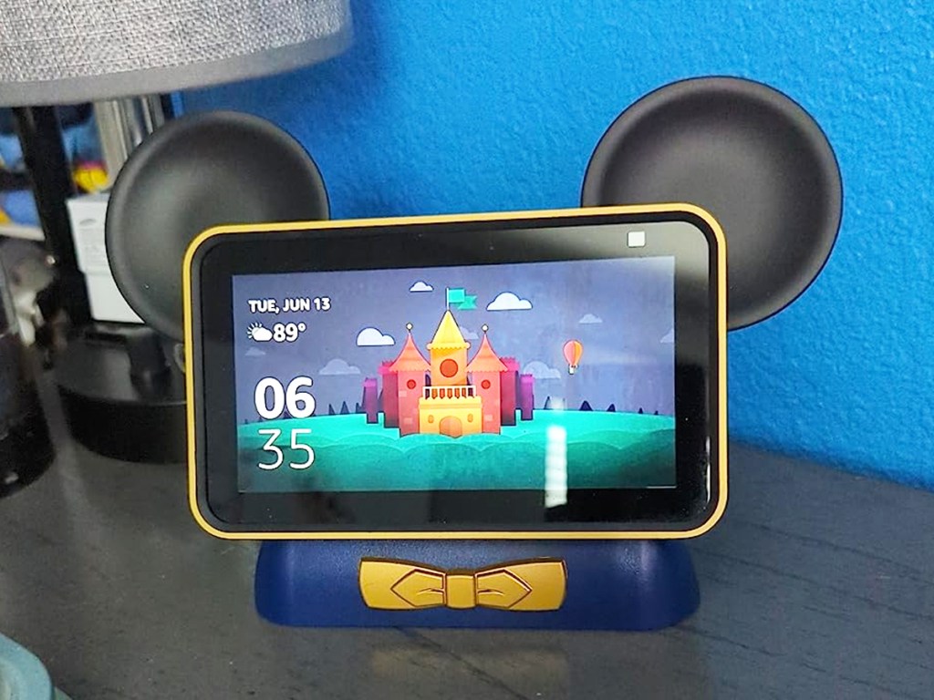echo show device in a black and blue mmickey mouse stand