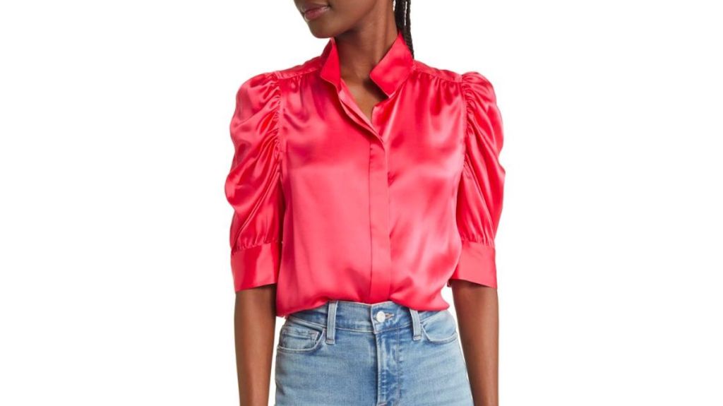stock photo of woman wearing hot pink blouse 