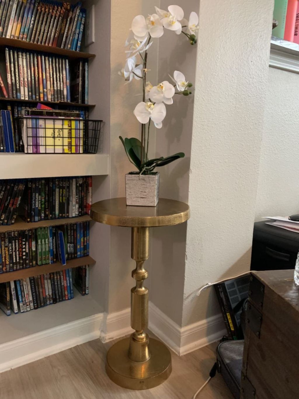 Side table with a flower on it