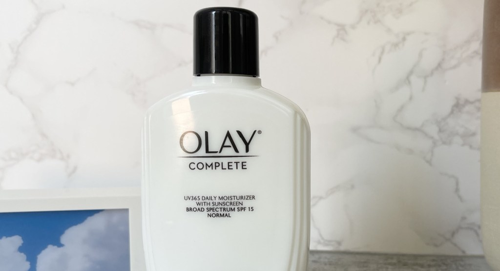 Olay mosturizer displayed in bathroom with marble walls