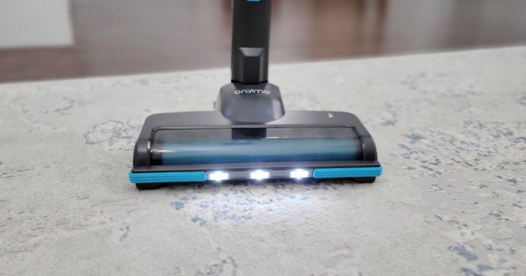 close up of stick vacuum on carpet