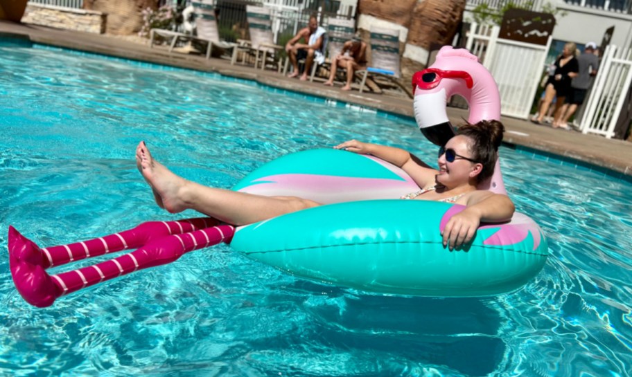 Girl on a pink flamingo Target pool float