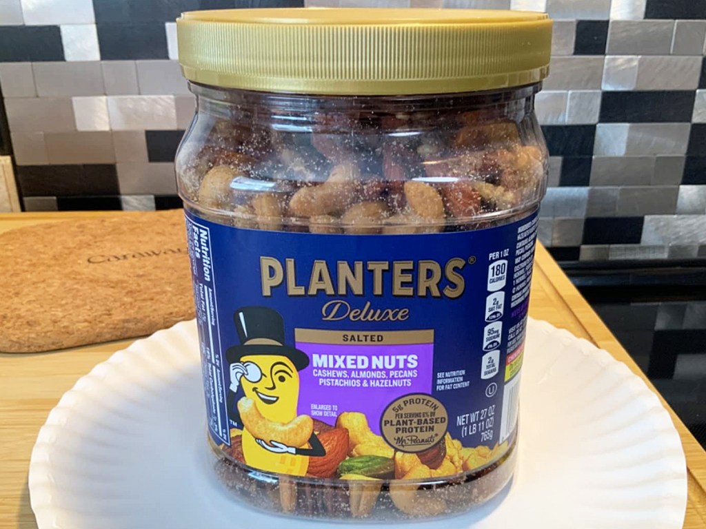 container of Planters Deluxe Salted Mixed Nuts on kitchen counter