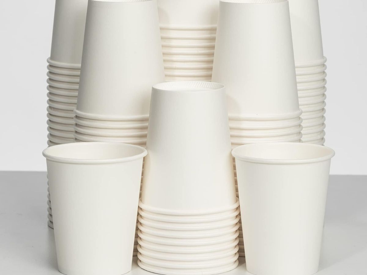 many white paper cups on a counter