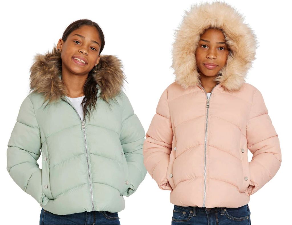 two models wearing Rothschild Youth Puffer Jackets in pink and green