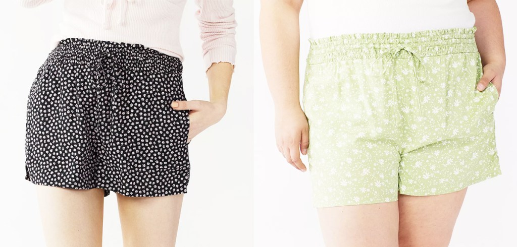 two women in black and green floral print shorts