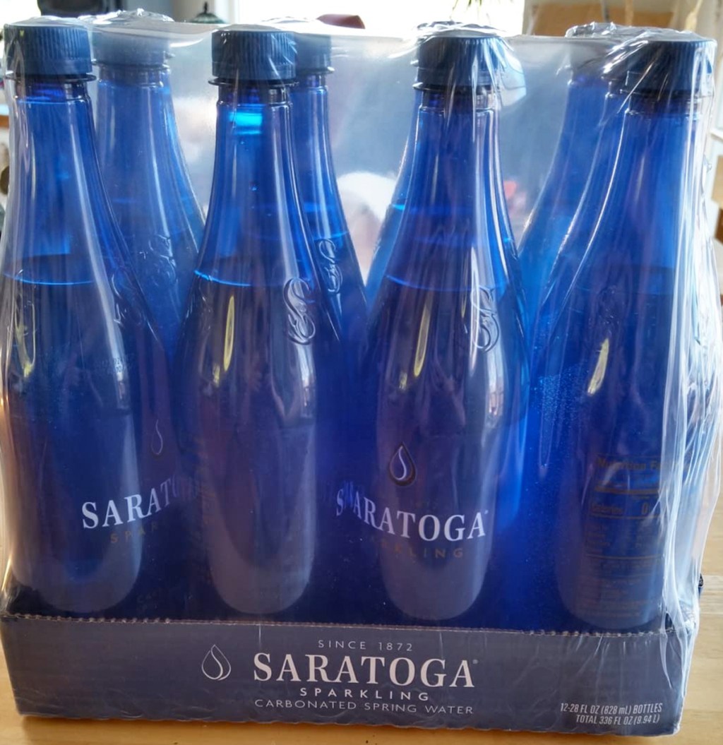 case of blue Saratoga Sparkling Spring Water bottles
