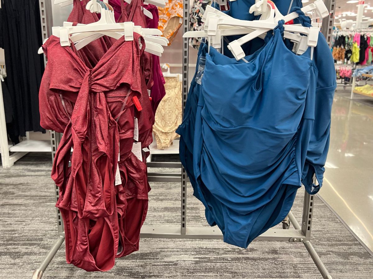 two womens one piece swimsuits hanging wracks at atarget 