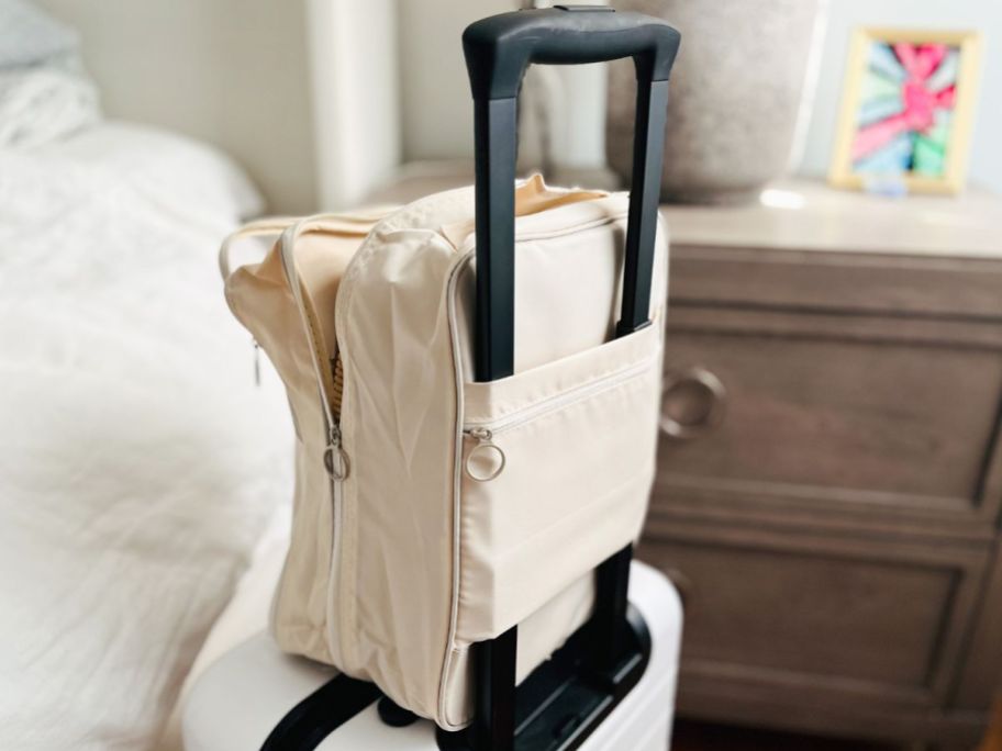 Travel shoe organizer bag on a suitcase handle