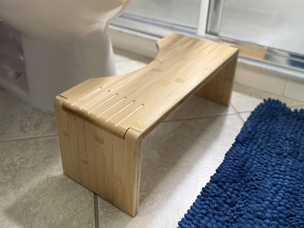 bamboo squatty potty in front of toilet