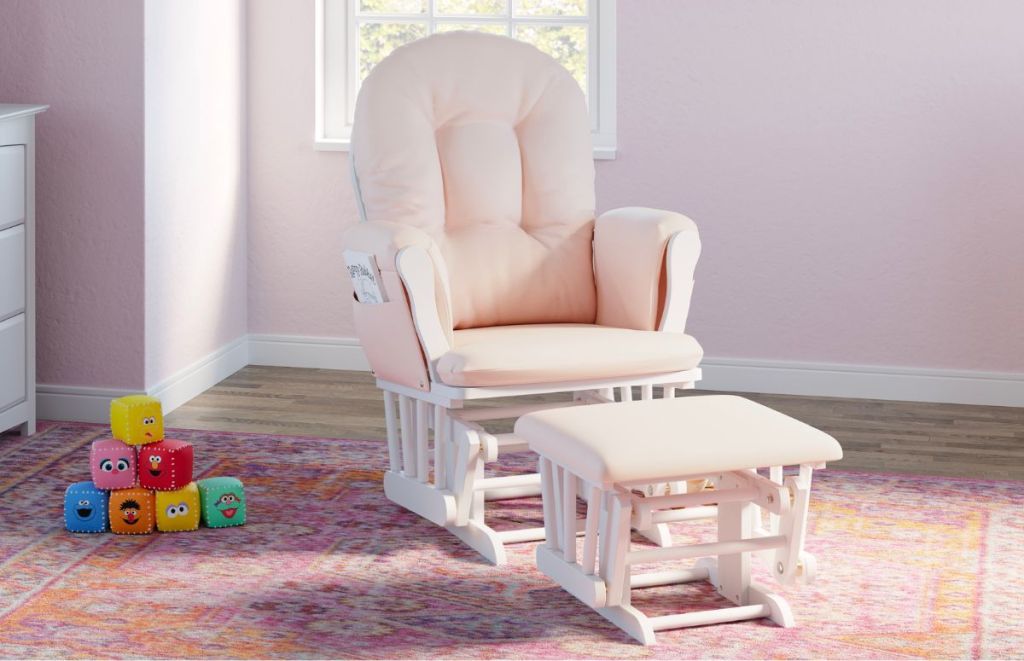 Storkcraft Hoop Nursery Glider and ottoman in white with pink cushions