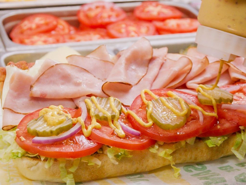 a subway sandwich being made
