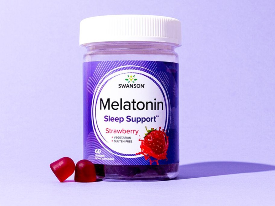 bottle of Swanson Premium Melatonin Gummies with purple background